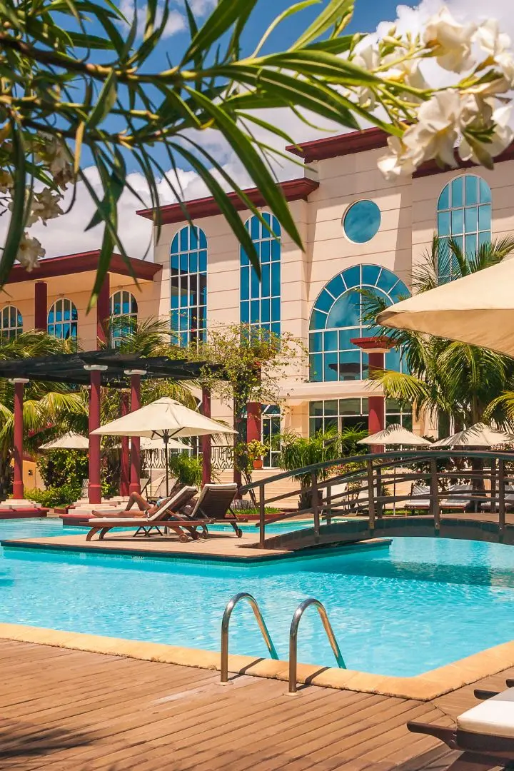 Hotel with pool and palm trees